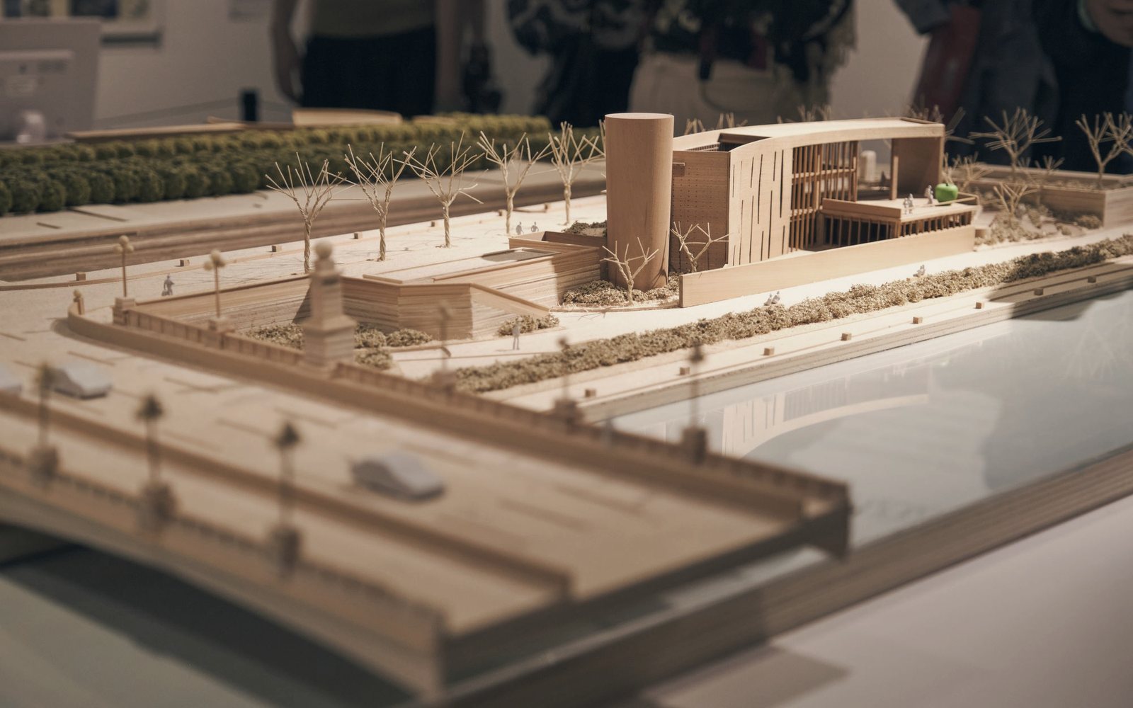 Temporary photograph of a timber architectural scale model in an exhibition setting